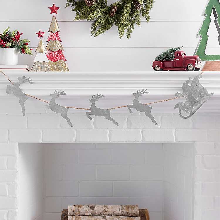 Santa’s sleigh and reindeer metal mantle decor