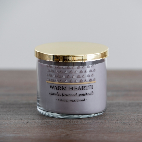 Hearth 3 wick candle is apart of our holiday edition. Hearth candle has  fragrance notes of warm cozy woods, that's been beautifully…
